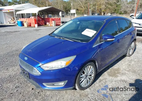 2015 Ford Focus Titanium z USA, uszkodzony, nr VIN 1FADP3N26FL205067